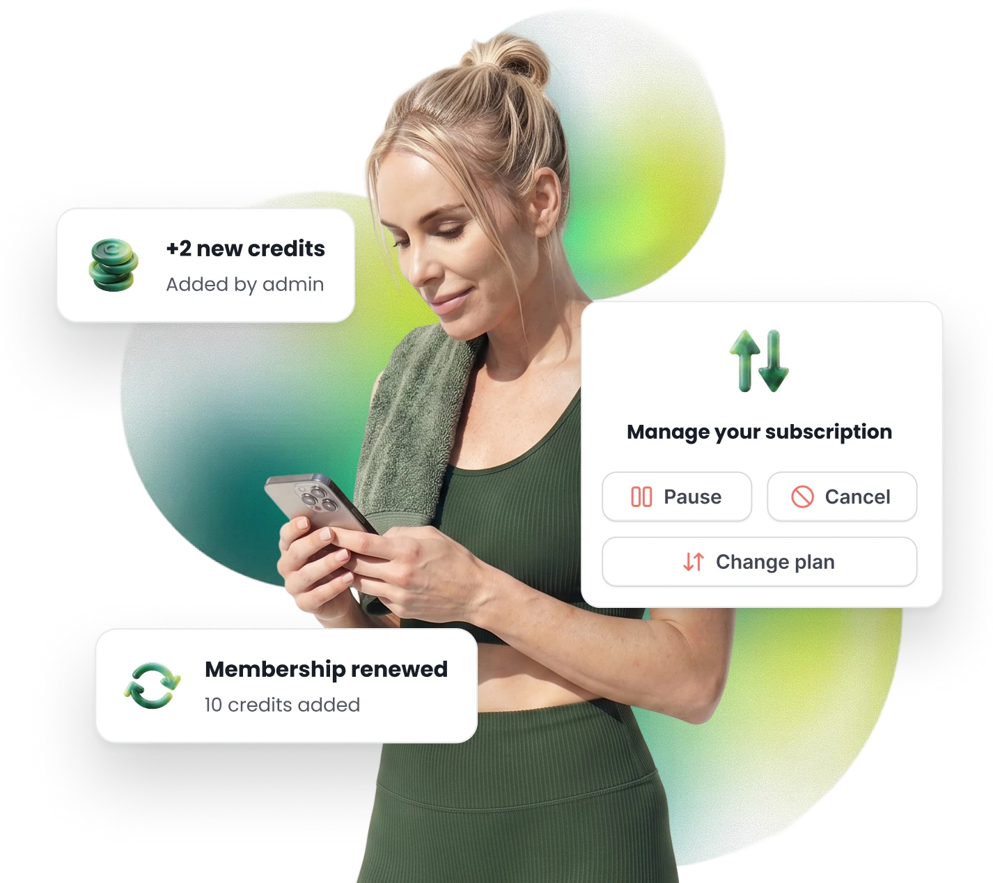 A member holding her phone, with her membership renewed, credits added by the studio, and the buttons to pause, cancel or change her plan.
