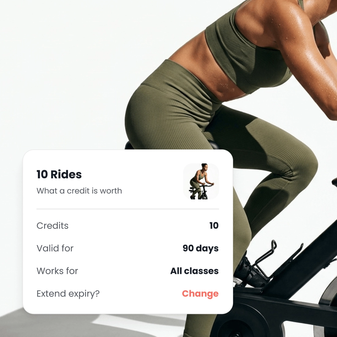 A rider standing on the pedals, beside a pack of ten rides showing the credits on it, how long they last and the classes they cover.